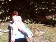 'Nicoletta sunbathes in a public garden wearing a big dirty diaper'
