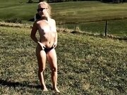 'little blonde walks naked in nature and plays with these feet'